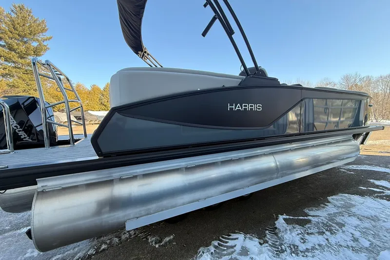 Slide: The Image of 2026 Harris Sunliner 230 pontoon boat on snowy ground, showcasing sleek design and modern features. - 19