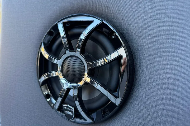 Slide: The Image of Close-up of a sleek speaker on the 2026 Harris Sunliner 230 boat. - 21