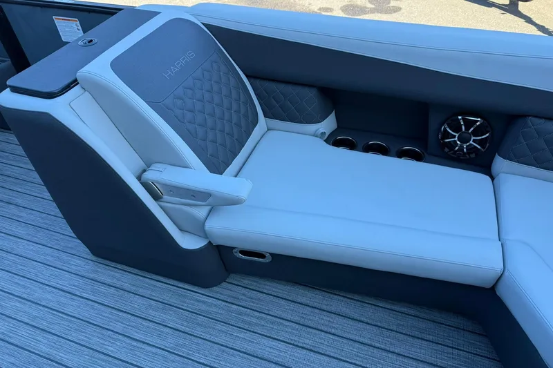 Slide: The Image of Luxurious seating on 2026 Harris Sunliner 230 boat with cup holders and speaker. - 23