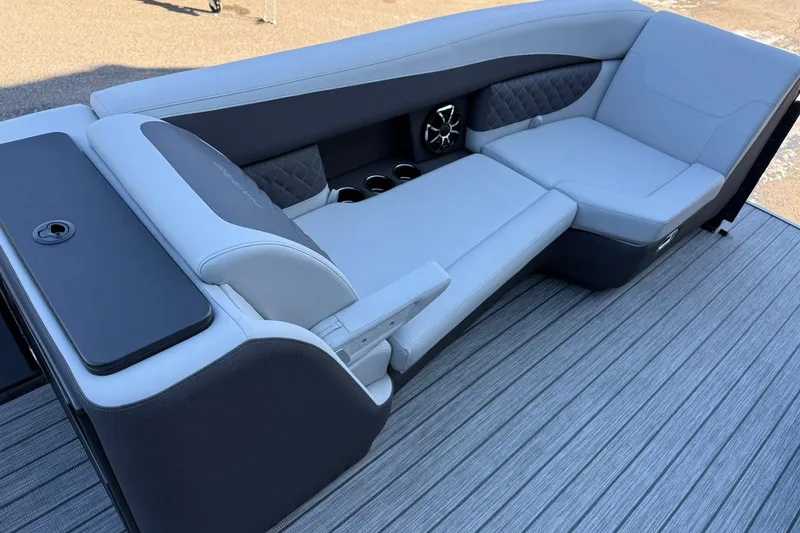 Slide: The Image of Luxurious seating on 2026 Harris Sunliner 230 pontoon boat with sleek design and cup holders. - 24