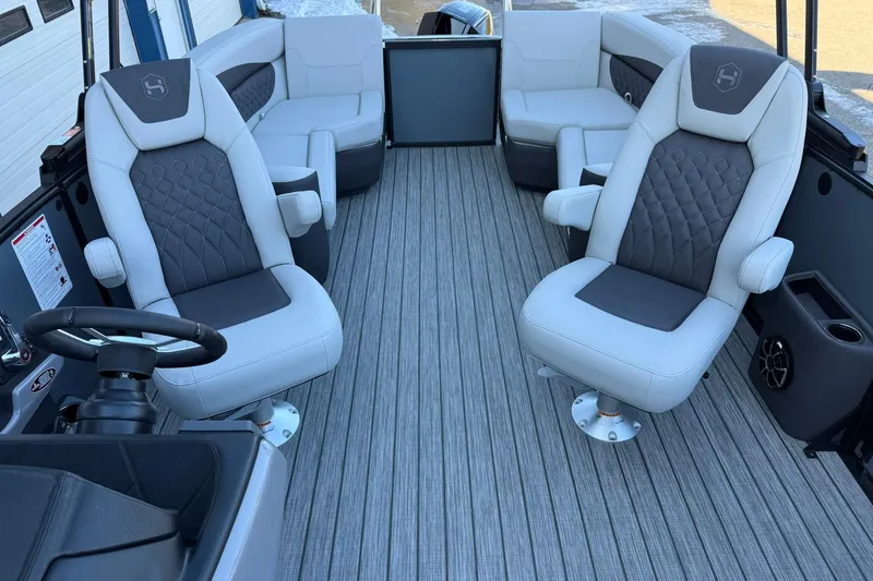 Slide: The Image of Luxurious interior of 2026 Harris Sunliner 230 pontoon boat with plush seating. - 27