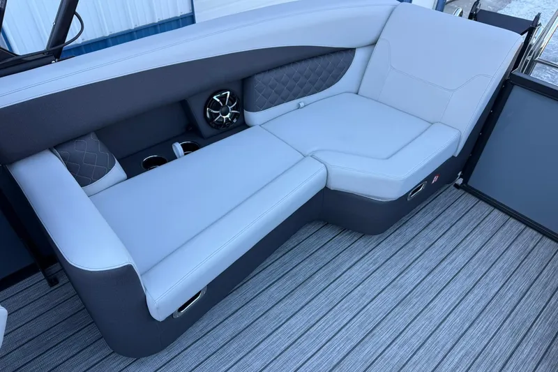 Slide: The Image of Luxurious seating on 2026 Harris Sunliner 230 boat with modern design and speaker system. - 28