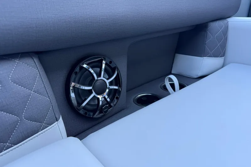 Slide: The Image of 2026 Harris Sunliner 230 interior with speaker and cup holders, featuring elegant upholstery. - 31