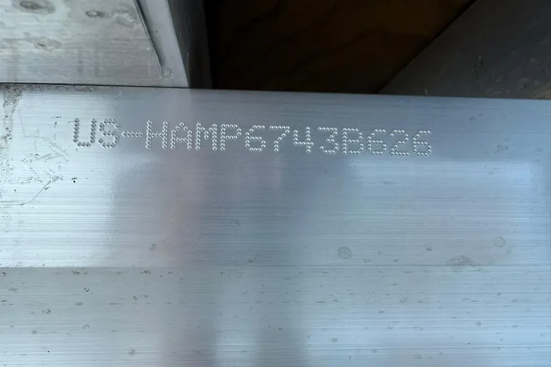 Slide: The Image of Serial number engraved on metal surface of 2026 Harris Sunliner 230. - 35