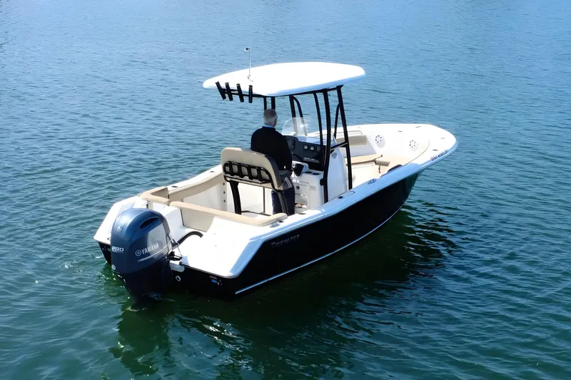 Slide: The Image of 2019 Tidewater 220 LXF boat on calm water, featuring Yamaha outboard motor. - 11