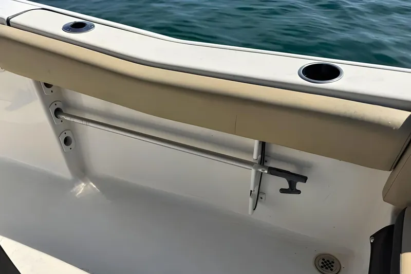 Slide: The Image of 2019 Tidewater 220 LXF boat interior with rod holder and cup holders. - 18