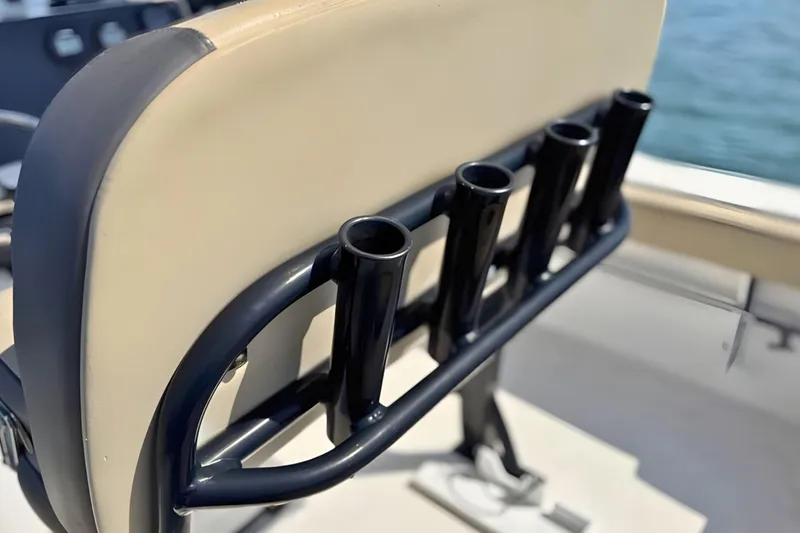 Slide: The Image of Rod holders on a 2019 Tidewater 220 LXF boat seat, near water. - 20