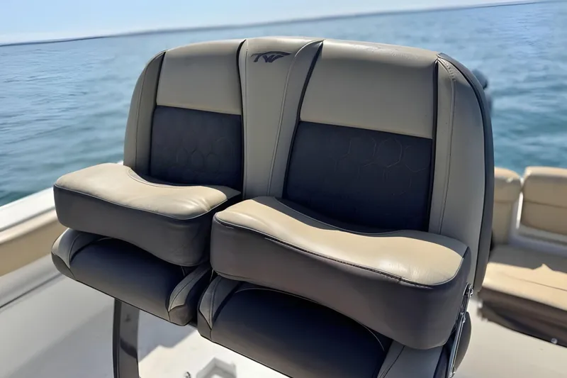 Slide: The Image of 2019 Tidewater 220 LXF boat seats with ocean backdrop. - 24