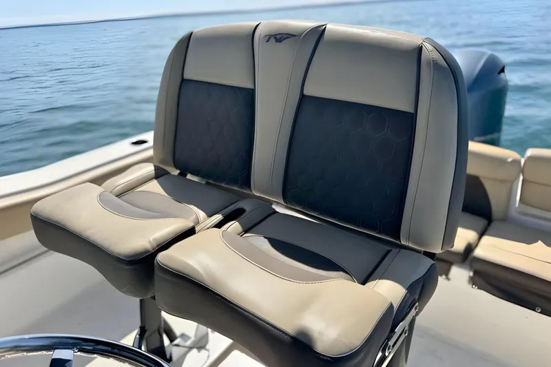 Slide: The Image of 2019 Tidewater 220 LXF boat seats with ocean view in background. - 25