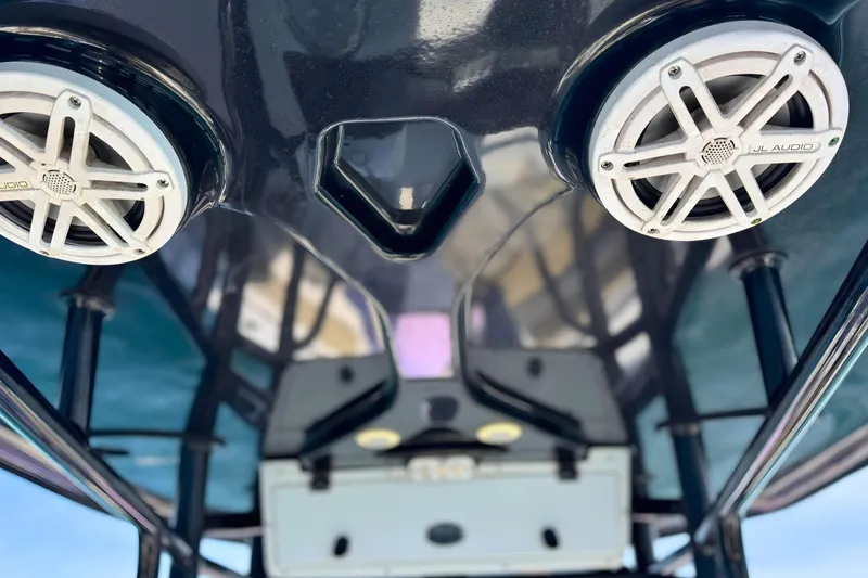 Slide: The Image of 2019 Tidewater 220 LXF boat with JL Audio speakers on the underside of the T-top. - 27