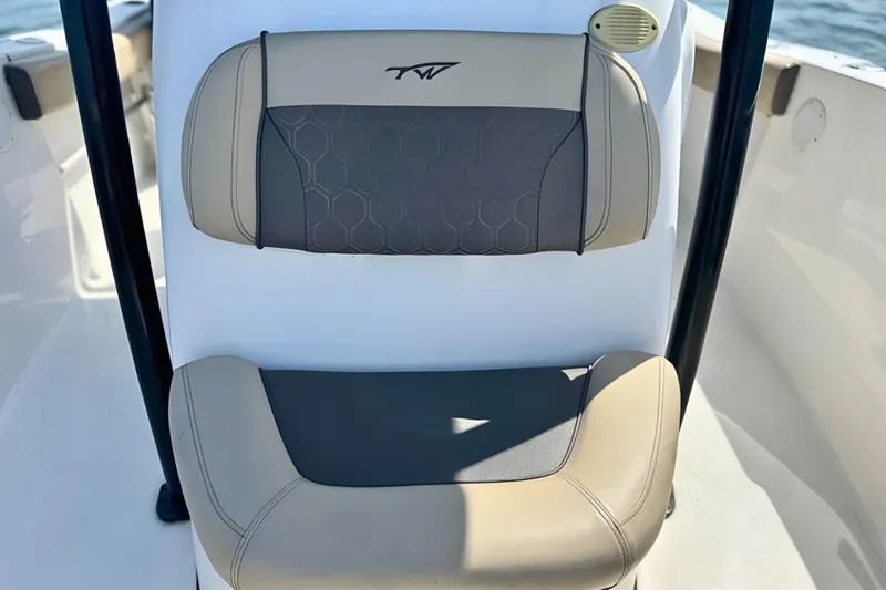 Slide: The Image of 2019 Tidewater 220 LXF boat seat with beige and gray upholstery. - 32