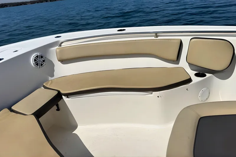 Slide: The Image of 2019 Tidewater 220 LXF boat interior with beige seating and ocean view. - 34