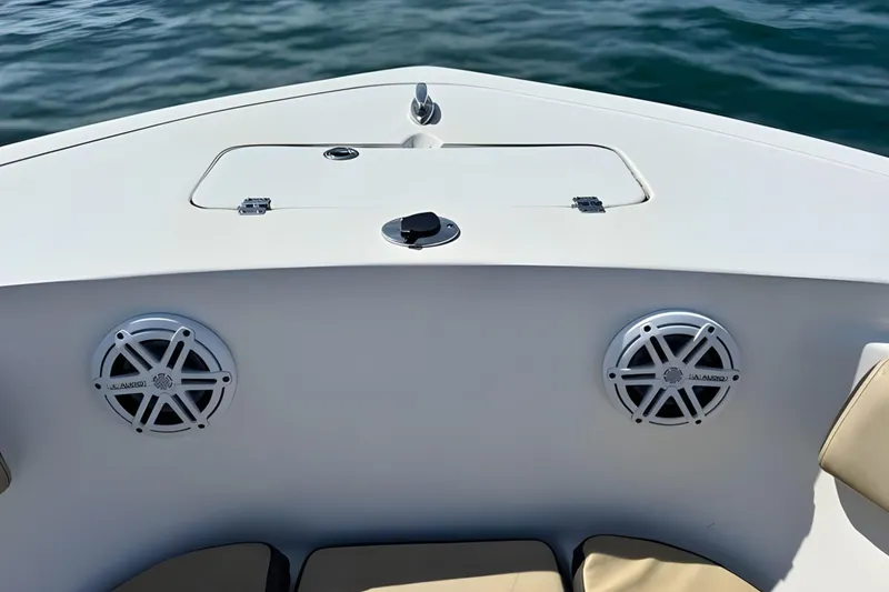 Slide: The Image of 2019 Tidewater 220 LXF boat bow with speakers and storage compartment. - 35
