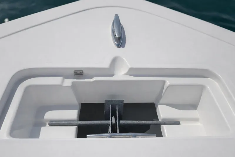 Slide: The Image of Bow anchor compartment of 2019 Tidewater 220 LXF boat, featuring sleek design and storage. - 36