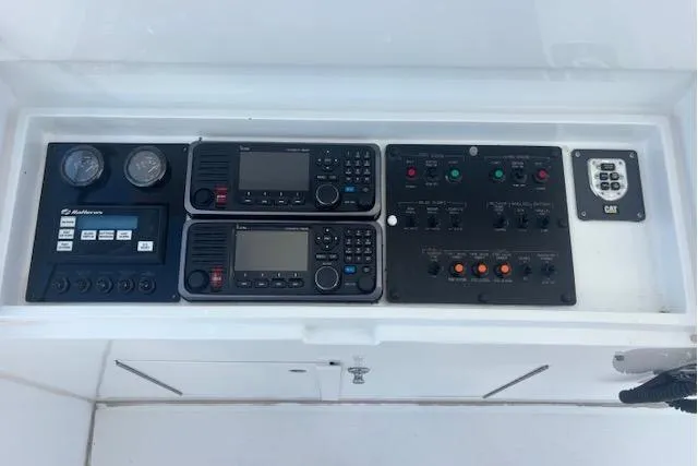 Slide: The Image of Control panel of 2006 Hatteras 50 Convertible yacht with navigation and communication equipment. - 17