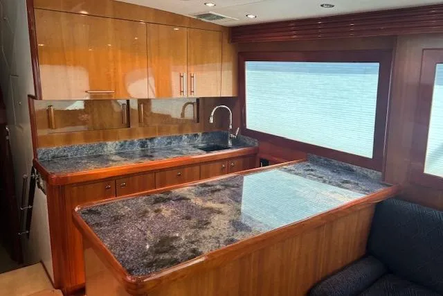 Slide: The Image of Luxurious kitchen interior of 2006 Hatteras 50 Convertible yacht with granite countertops. - 19