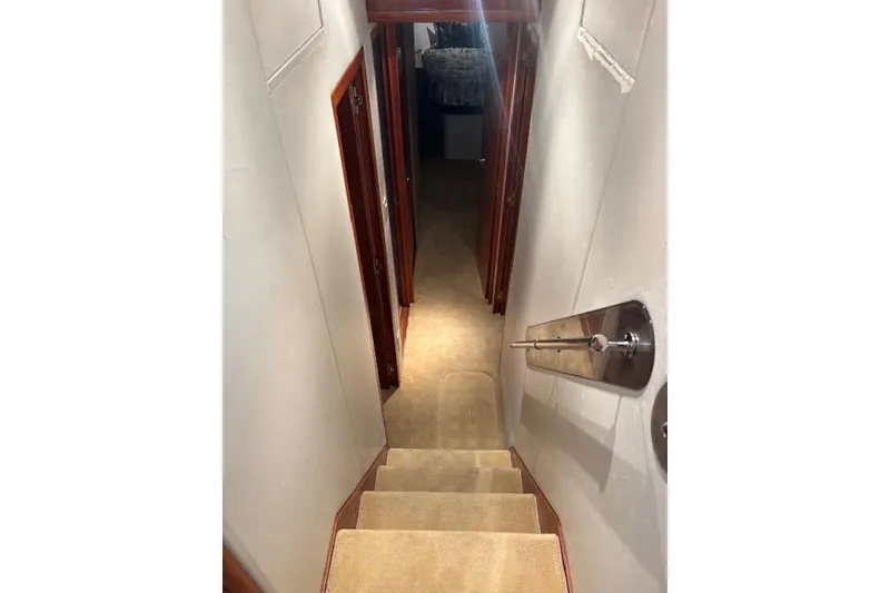 Slide: The Image of Interior staircase of 2006 Hatteras 50 Convertible yacht, leading to cabin area. - 22