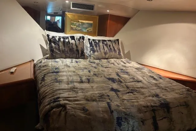 Slide: The Image of Luxurious bedroom interior of 2006 Hatteras 50 Convertible yacht with elegant bedding. - 25