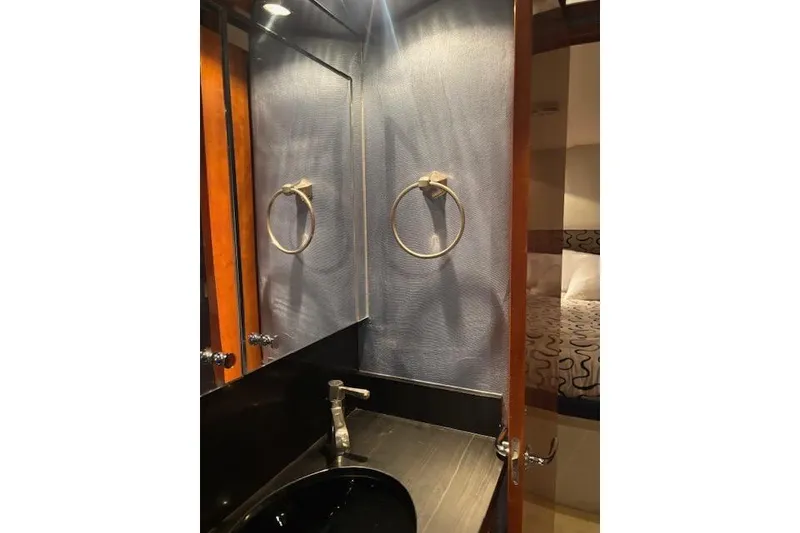 Slide: The Image of Luxurious bathroom interior of 2006 Hatteras 50 Convertible yacht with modern fixtures. - 26