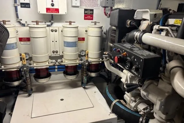 Slide: The Image of Engine room of 2006 Hatteras 50 Convertible yacht, showcasing machinery and components. - 29
