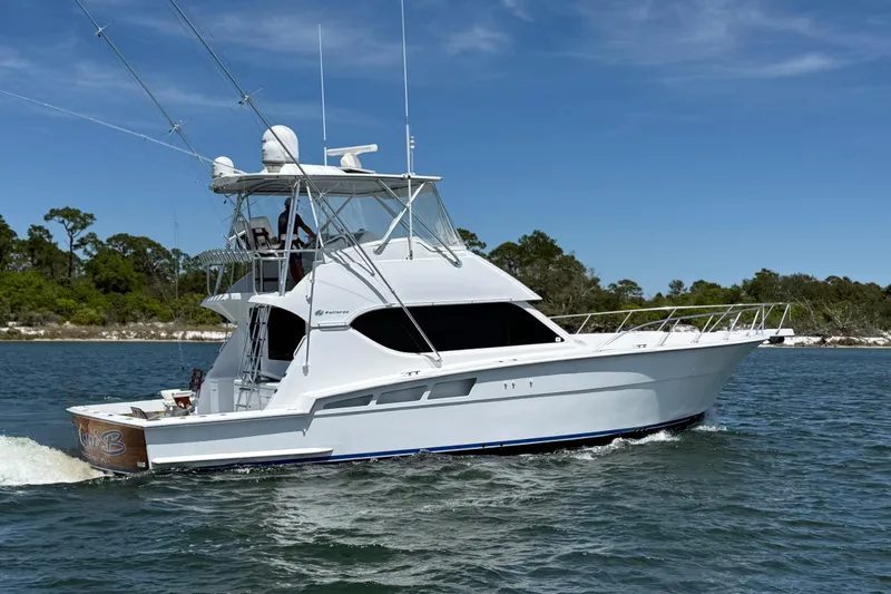 Slide: The Image of 2006 Hatteras 50 Convertible yacht cruising on a sunny day. - 3