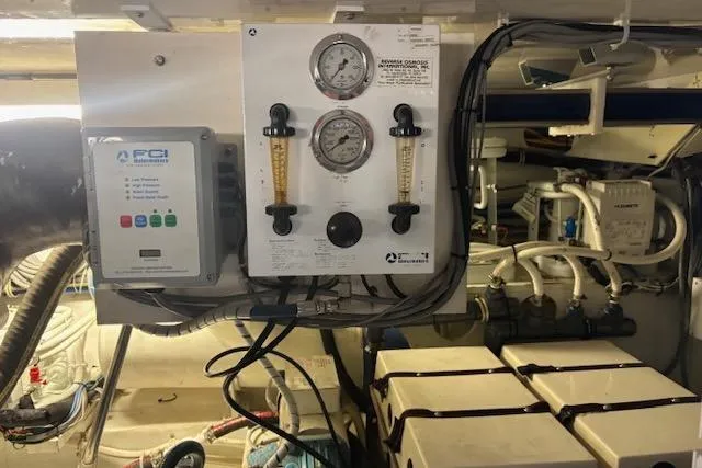 Slide: The Image of Engine room of 2006 Hatteras 50 Convertible with control panel and gauges. - 31