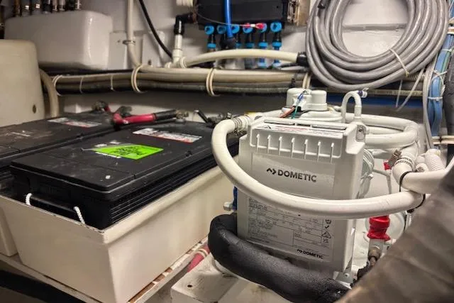 Slide: The Image of Engine room of 2006 Hatteras 50 Convertible with Dometic equipment and batteries. - 33