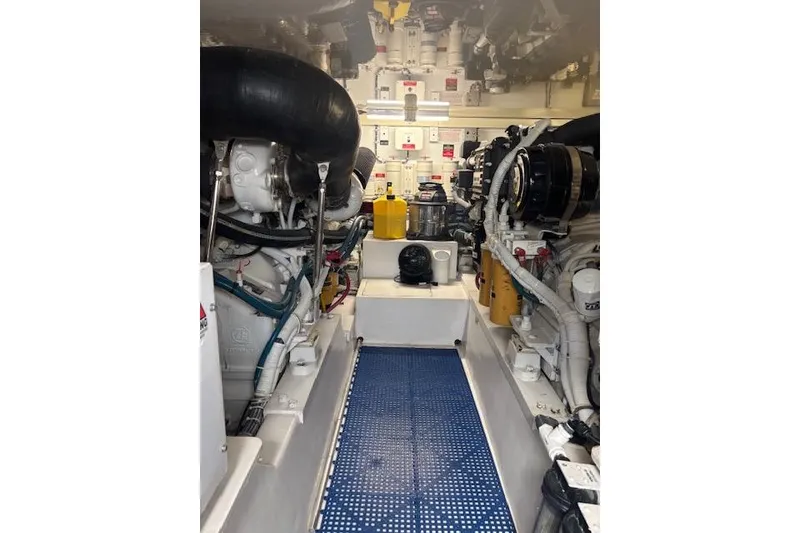 Slide: The Image of Engine room of 2006 Hatteras 50 Convertible yacht, showcasing machinery and equipment. - 34