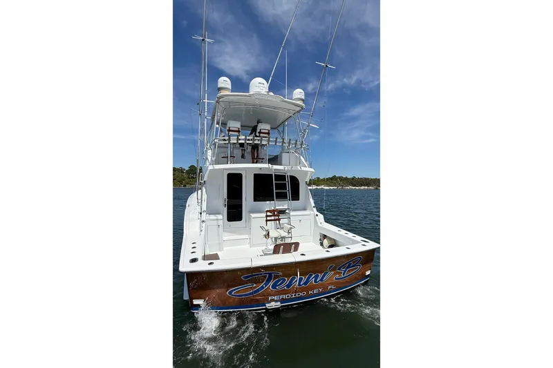 Slide: The Image of 2006 Hatteras 50 Convertible yacht on water, rear view, clear sky. - 7