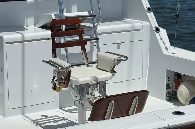 Slide: The Image of Fishing chair on 2006 Hatteras 50 Convertible yacht deck, with ocean backdrop. - 8