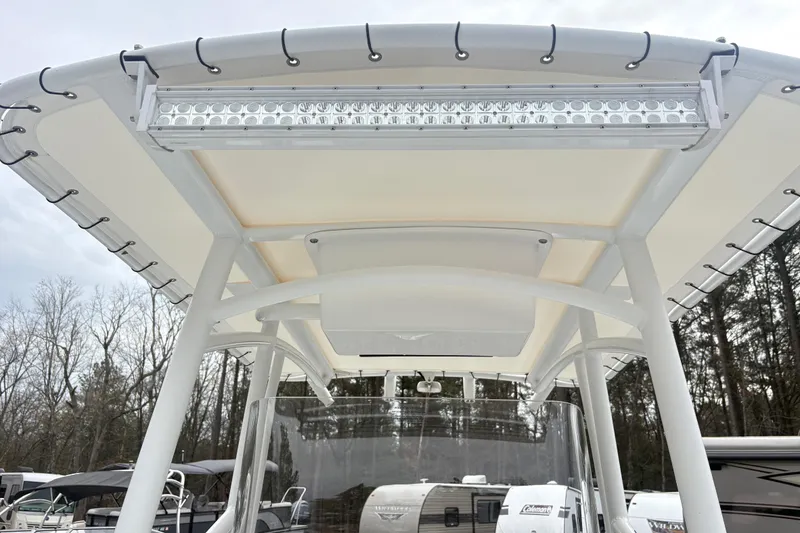 Slide: The Image of 2022 Wellcraft 222 Fisherman boat with T-top and LED light bar. - 11