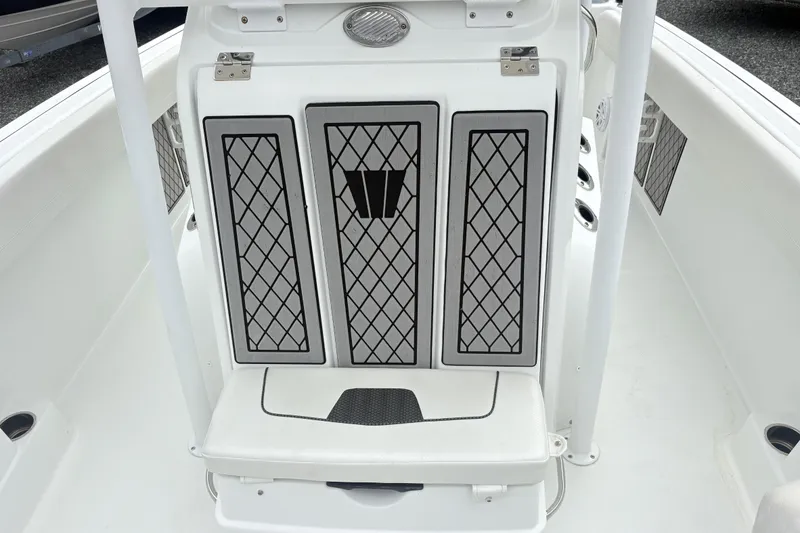 Slide: The Image of 2022 Wellcraft 222 Fisherman boat interior with diamond-patterned seat design. - 12