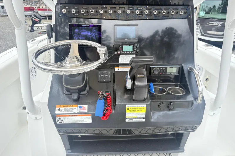 Slide: The Image of Control panel of 2022 Wellcraft 222 Fisherman boat with steering wheel and navigation equipment. - 15