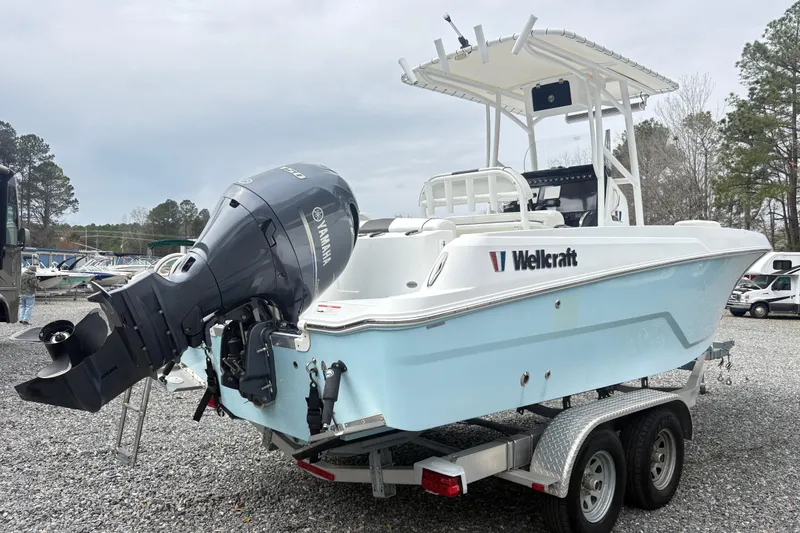 Slide: The Image of 2022 Wellcraft 222 Fisherman boat with Yamaha outboard motor on a trailer. - 3