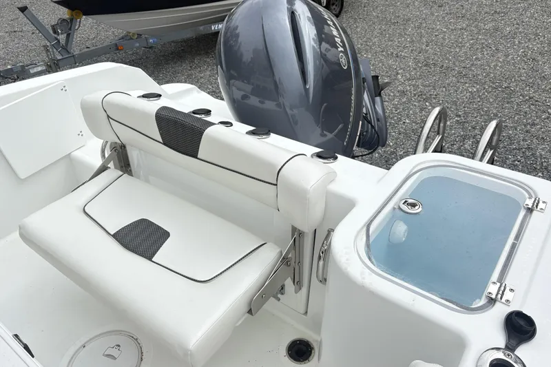 Slide: The Image of 2022 Wellcraft 222 Fisherman boat interior with seating and Yamaha outboard motor. - 7