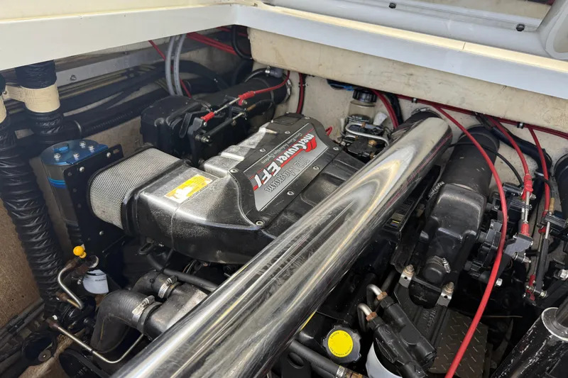 Slide: The Image of Engine compartment of a 1994 Formula 419 SR-1 boat, showcasing detailed mechanical components. - 10