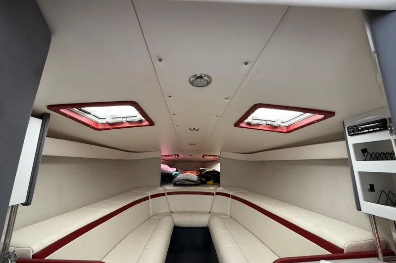 Slide: The Image of Interior of a 1994 Formula 419 SR-1 boat with white and red seating. - 15