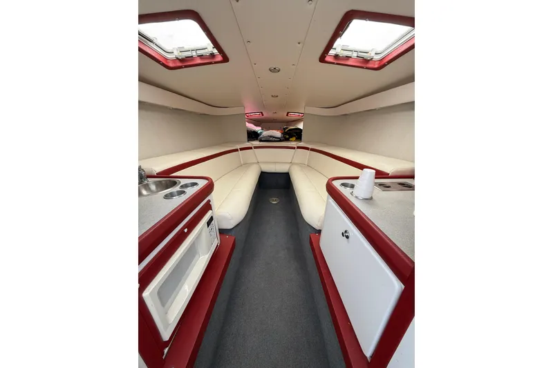 Slide: The Image of Interior of a 1994 Formula 419 SR-1 boat with white and red seating. - 16
