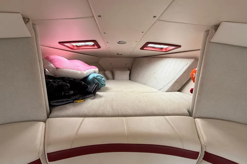 Slide: The Image of Interior cabin of a 1994 Formula 419 SR-1 boat with cushions and pillows. - 17