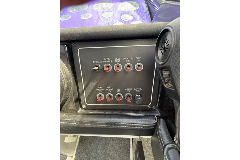 Slide: The Image of Control panel of a 1994 Formula 419 SR-1 boat with various switches and dials. - 19