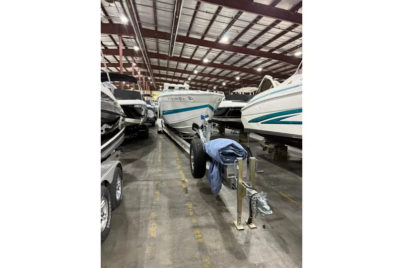 Slide: The Image of 1994 Formula 419 SR-1 boat stored indoors on a trailer in a warehouse. - 3