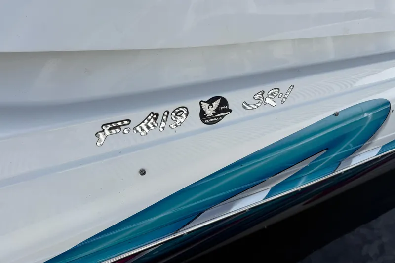 Slide: The Image of 1994 Formula 419 SR-1 boat emblem with blue and white design. - 4