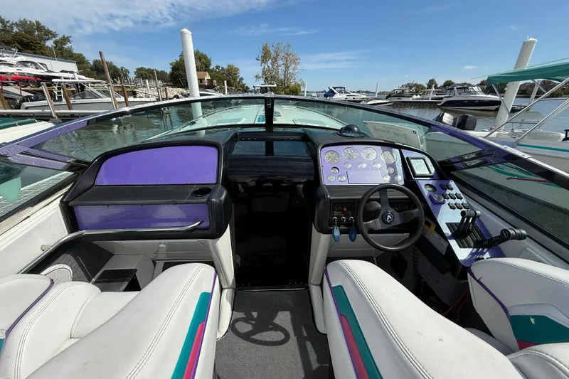 Slide: The Image of Interior of a 1994 Formula 419 SR-1 speedboat with modern dashboard and controls. - 8