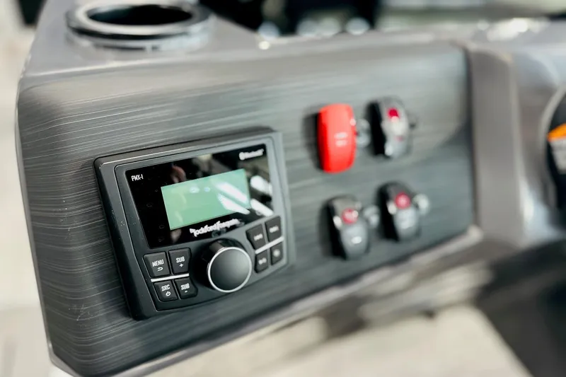 Slide: The Image of Control panel of 2026 Bennington 22 SSR boat with audio system and switches. - 4