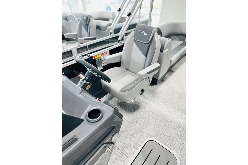 Slide: The Image of 2026 Bennington 22 SSR boat interior with modern steering and seating. - 5