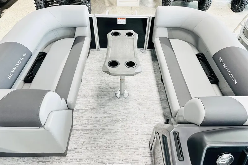 Slide: The Image of Interior of 2026 Bennington 22 SSR pontoon boat with gray seating and central table. - 7