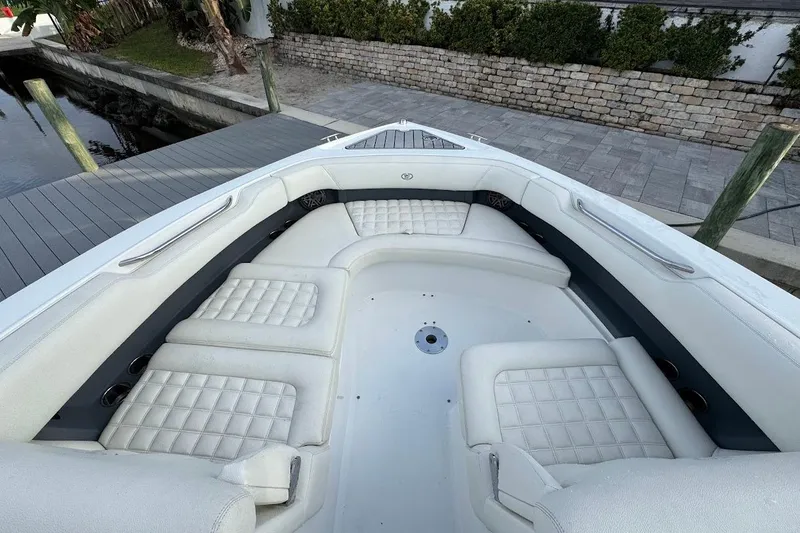 Slide: The Image of 2018 Cobalt 30SC boat with luxurious white seating and spacious deck area. - 27