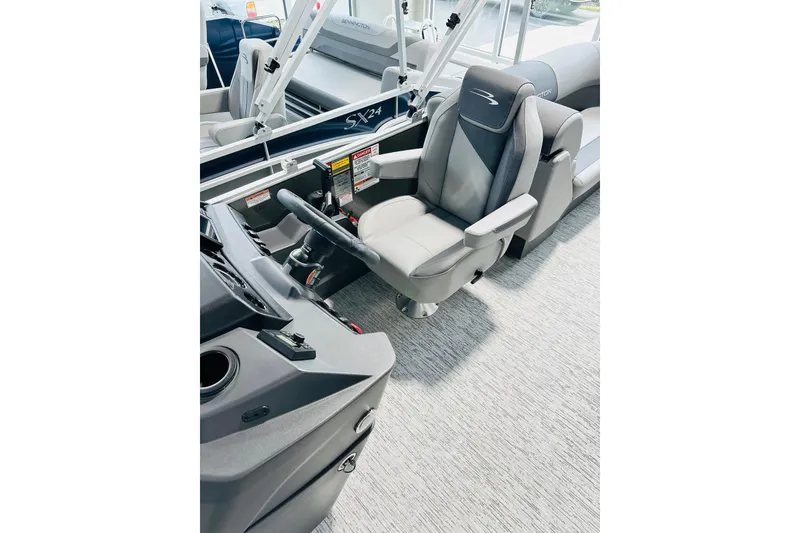 Slide: The Image of Captain's chair and helm of 2026 Bennington 23 SSR pontoon boat interior. - 5