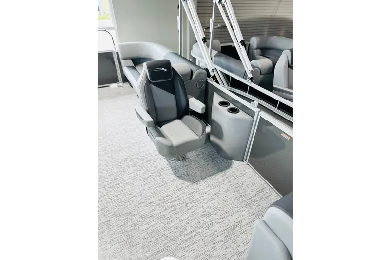Slide: The Image of Luxurious interior of 2026 Bennington 23 SSR pontoon boat with plush seating and cup holders. - 6