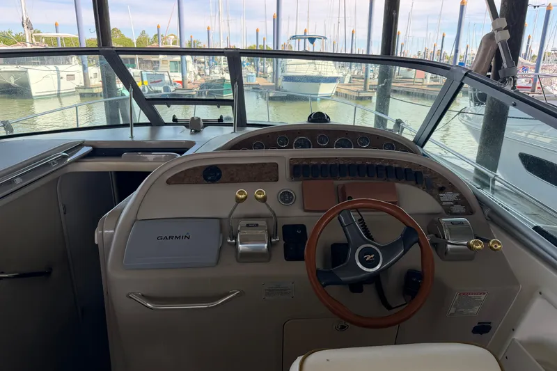 Slide: The Image of Cockpit of 2000 Sea Ray Sundancer 310 with Garmin navigation, docked at marina. - 11